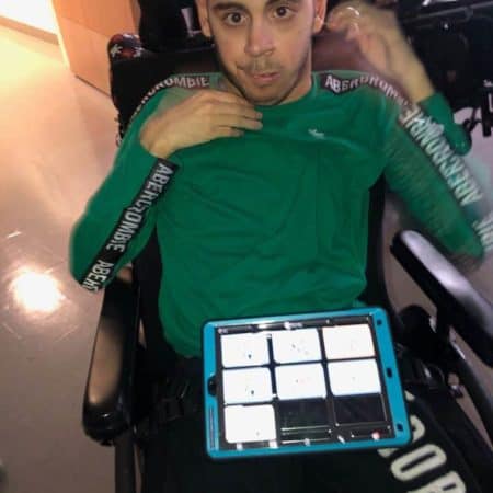 Student with personalized augmentative communication device