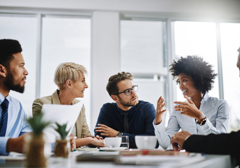 Shot of a group of businesspeople sitting together in a meeting