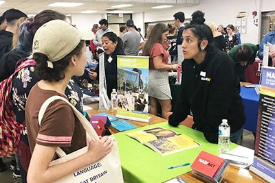 staff and student at college fair